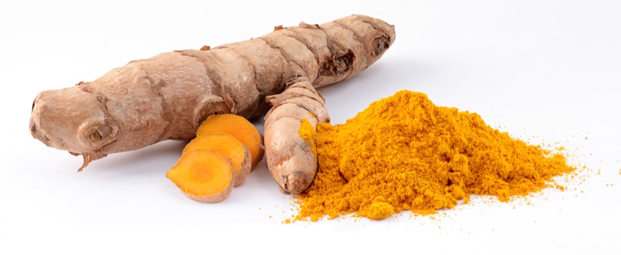 Haridra — Turmeric (Curcuma longa): fresh rhizome and powder. Stack of 5 images, combined with CombineZP.